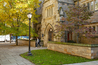 Student walking out of Jonathan Edwards College