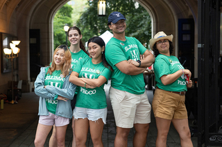 Students wearing Silliman College shirts pose for picture together during 2024 move-in day