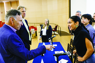 PLC members gathered in discussion at a PLC event