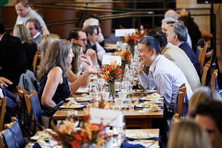 Attendees sitting together eating at a table during the 2024 PLC Fall Gathering